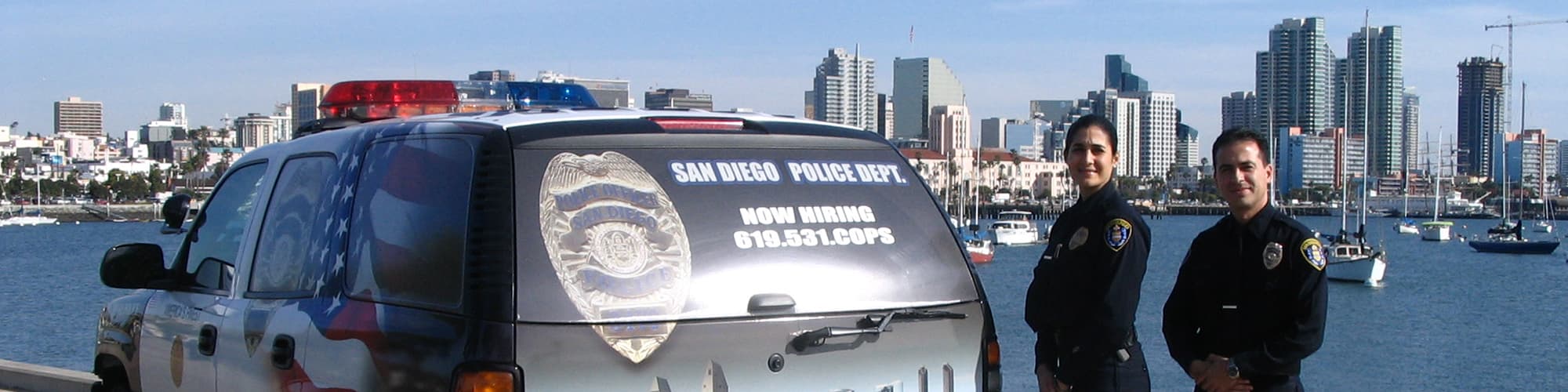 San Diego Police Department officers with van and bay